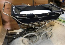 A Silver Cross pram with folding hoods to either end on a chrome plated sprung twin axle base 125 cm