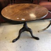 A late George III mahogany tea table, the circular top on a turned pedestal to cabriole tripod base,