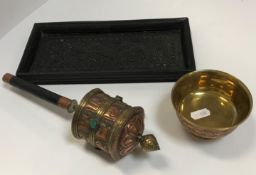 A Tibetan brass and copper prayer wheel with turquoise inset medallions, together with a similar