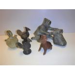 A collection of various pre-Colombian style pottery including a red slip bottle as a cat or dog with