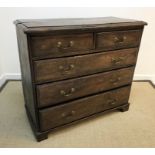 A 19th Century oak chest, the top with moulded edge over two short and three long graduated