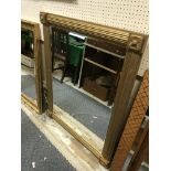 A modern Victorian style reeded gilt framed wall mirror with floral medallion corners, 92 cm x 118