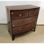 A 19th Century mahogany and satinwood strung bow fronted chest of two short over two long drawers on