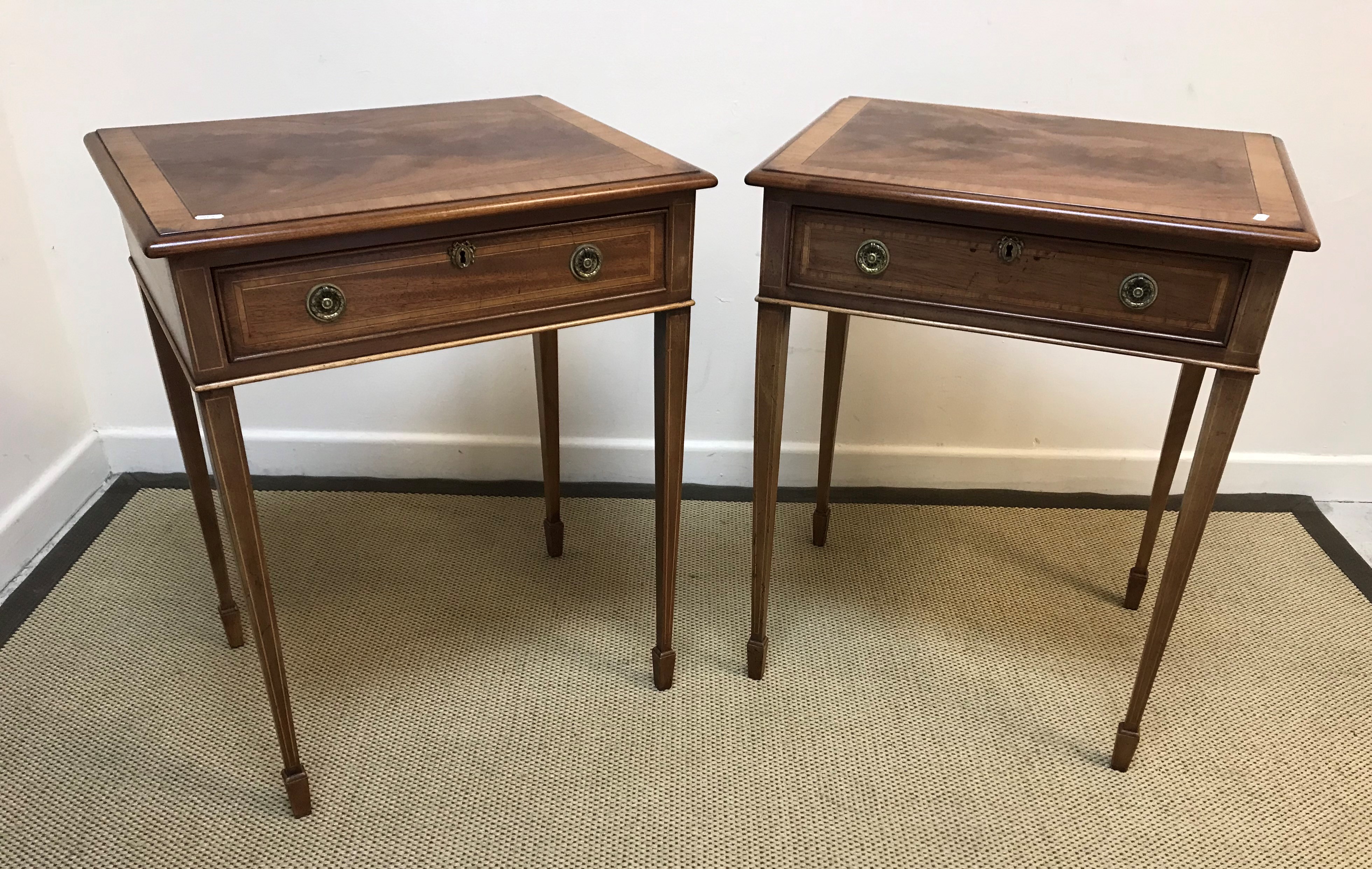 A pair of mahogany and inlaid lamp tables in the Regency taste, the cross-banded tops with moulded
