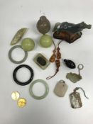 A collection of modern Chinese carved hardstone items to include a smoky quartz figure of an eagle