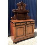 A late 19th Century Continental walnut and ebonised side cabinet, the shelved superstructure with