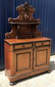 A late 19th Century Continental walnut and ebonised side cabinet, the shelved superstructure with