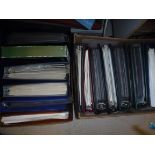 Sixteen albums of various first day covers, together with an album and bag of various postcards