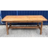 A French style pine farmhouse kitchen table, the plank top with cleated ends on rectangular supports