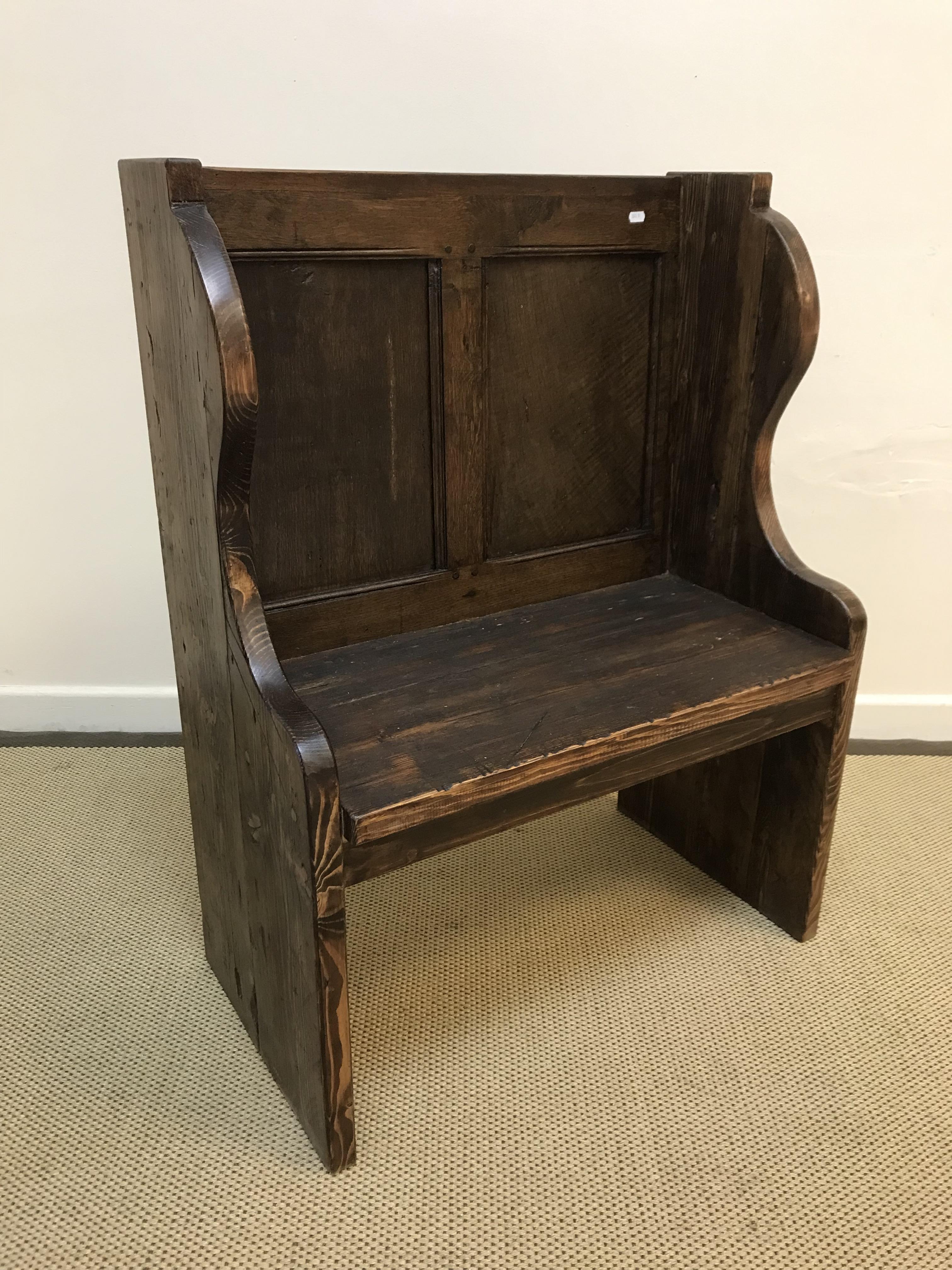 An oak and pine single seat pew or hall bench, the twin panel back over a single plank seat,