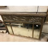 A Victorian gilt framed overmantel mirror with relief work frieze decorated with Classical scene