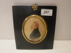 N C LARKIN "Gentleman in black coat and white stock facing left", a head and shoulders miniature