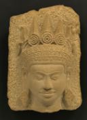 A modern carved stone Khmer style carved stone Apsara Buddha head, 27 cm x 20.5 cm approx, frame