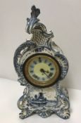 A Royal Bonn "Delft" pottery blue and white rococco style cased mantel clock No'd verso "3924-42-