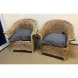A pair of modern canework conservatory scroll arm chairs on baluster front legs, 82 cm wide x 82