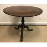 A 19th Century mahogany circular occasional table on tripod base, 79 cm x 62 cm, together with