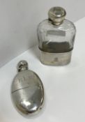 A Victorian silver hip flask of oval form with integral cup, bearing initials "E.L.R." (by Frederick