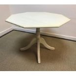 A modern painted octagonal kitchen table on pedestal base with circular extension cover 106 cm