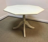 A modern painted octagonal kitchen table on pedestal base with circular extension cover 106 cm