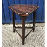 A 19th Century elm and oak cricket table, the triangular top with canted corners and applied beading
