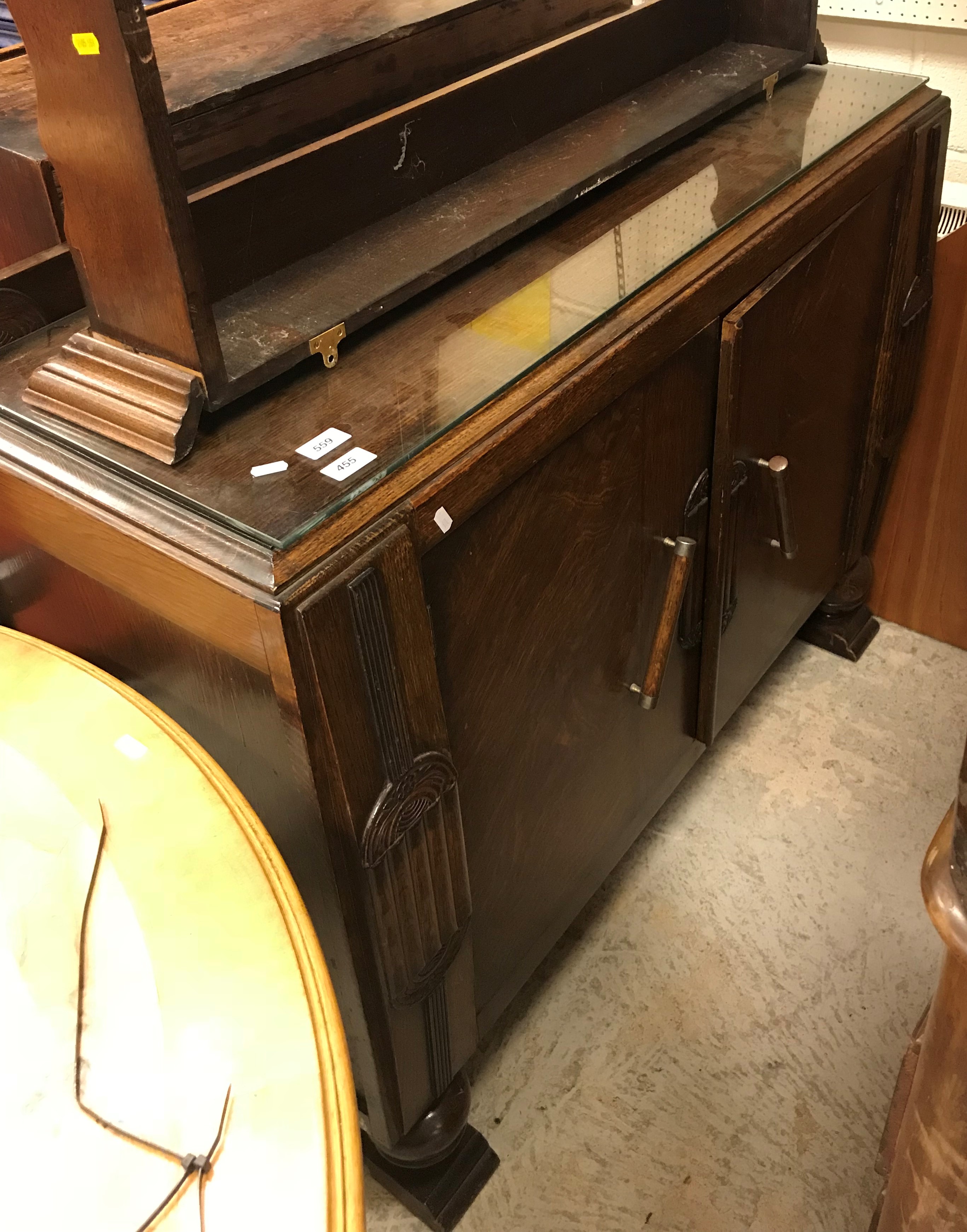 A 1930's oak sideboard, oak plate rack, mahogany chest of two drawers over two cupboard doors,