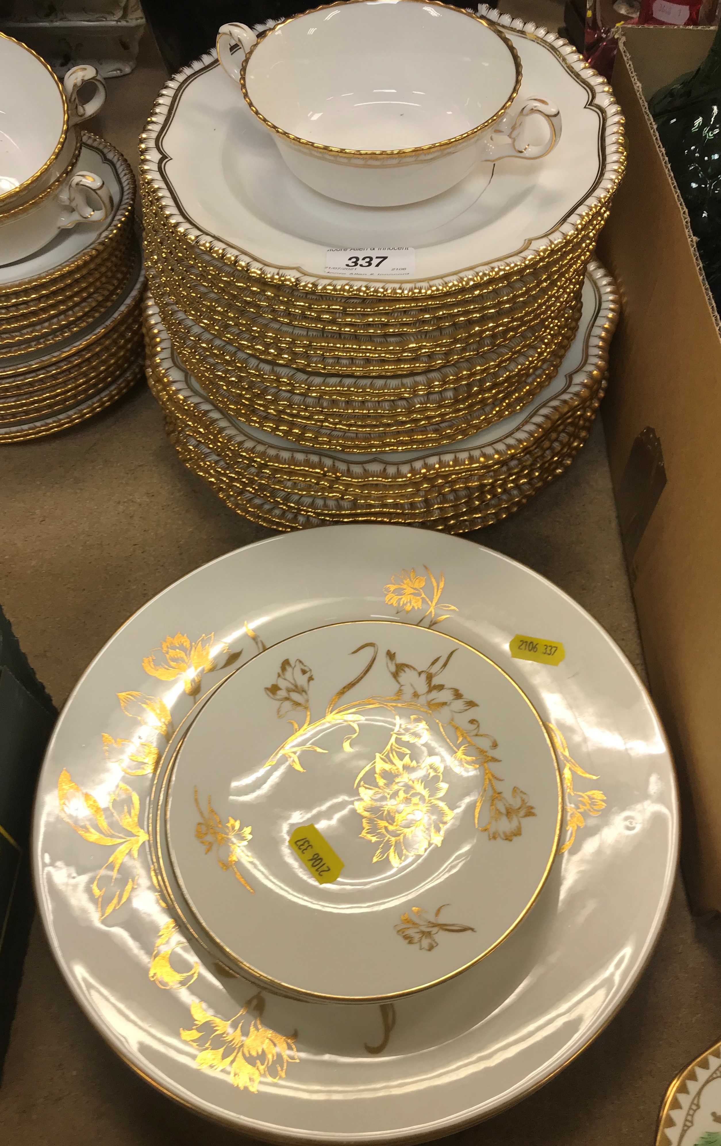 A Spode white glazed and gilt decorated part dinner service with gadrooned rim, design No. 1/4223,
