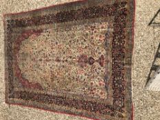 A Tabriz type carpet, the central panel set with foliate and bird decoration and central vase of