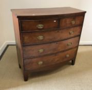A 19th Century mahogany bow fronted chest, the plain top over two short and three long graduated