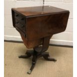 A 19th Century mahogany drop-leaf work table, with two drawers above a work basket on U shaped
