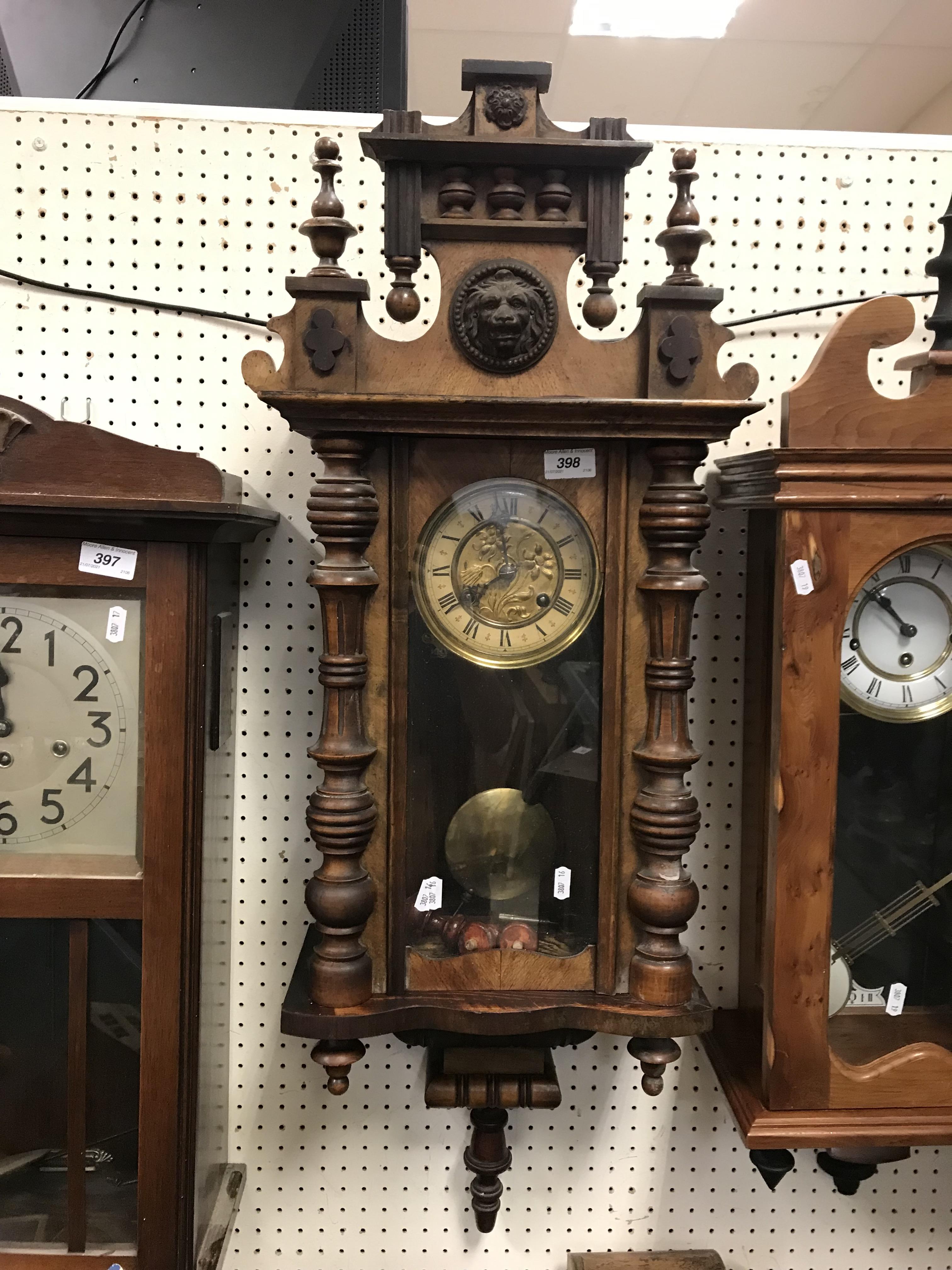 A 19th Century walnut cased Vienna regulator, the eight day movement with paper chapter ring and