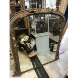 A Victorian gilt and gesso framed dome top overmantel mirror, 95 cm wide x 116.5 cm high