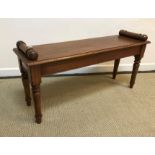 An oak window seat in the Victorian manner, the single plank top with moulded edge and scroll