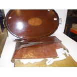 An Edwardian mahogany and fan marquetry inlaid two handled drinks' tray of oval form with brass