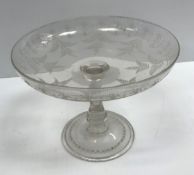 A 19th Century engraved glass tazza with fern and foliate decoration, raised on a circular folded