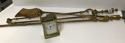 An early 20th Century brass cased carriage clock, the enamel dial with Roman numerals 11 cm high