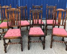 A set of four early 20th Century carved oak dining chairs in the Carolean taste and two similar with