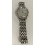 A Lady's Citizen Eco-Drive wristwatch with simulated diamond bezel and mother of pearl face with