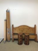 A modern pitch pine double bedstead with plain panelled ends on turned feet, 151 cm wide, together