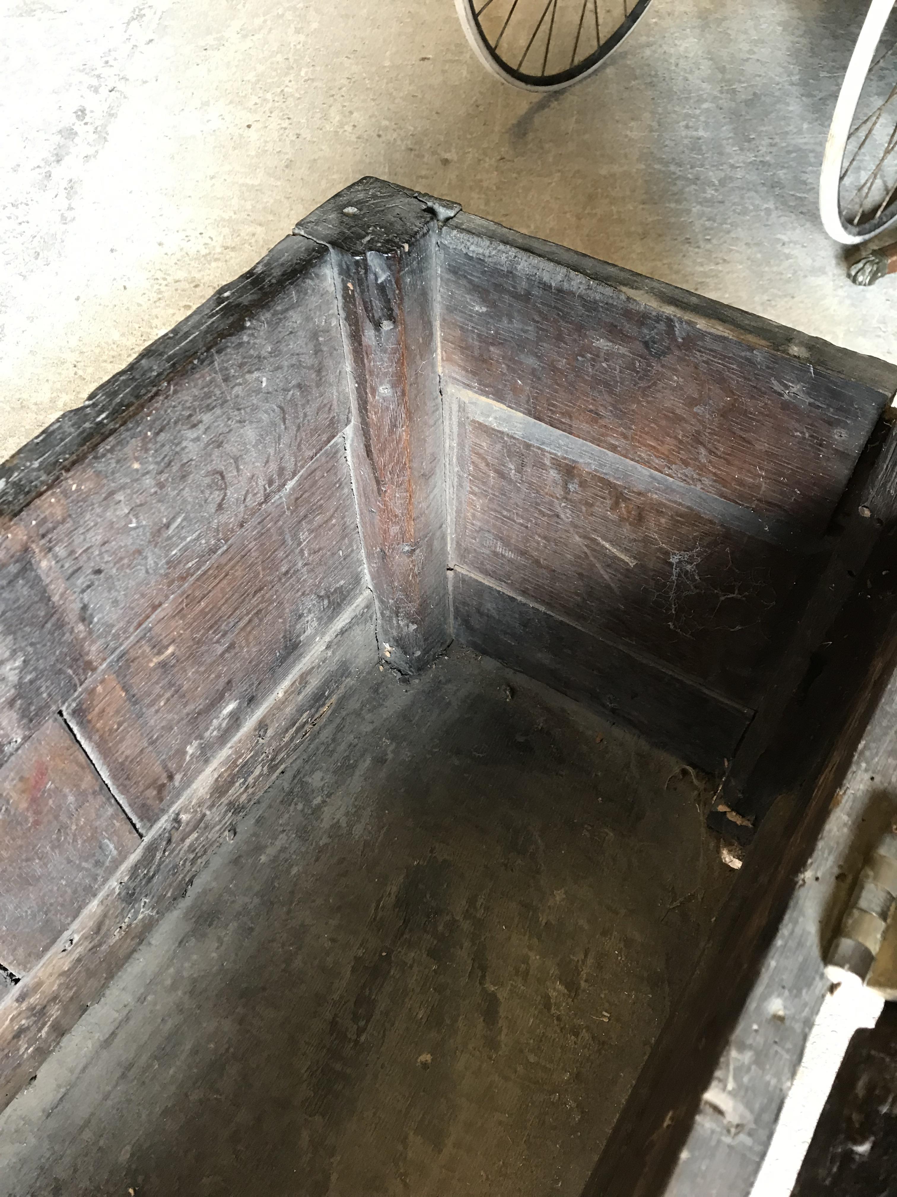 An 18th Century oak coffer, the single piece carved plank top over a three panel front with - Image 21 of 24