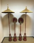 A pair of 20th Century cinnabar lacquered gilded and mirrored ceremonial fans of paddle form, raised