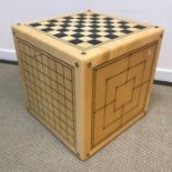 An Alison Henry game cube table each side with different games board together with games pieces 49