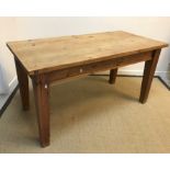 A modern pine farmhouse style kitchen table with single end drawer on square supports by Mulberry