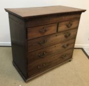 A 19th Century mahogany chest, the plain top with dentil cornice over two short and three long