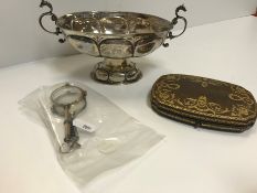 A Continental white metal twin handled pedestal bowl of oval form bearing engraved Armorial