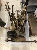 A collection of various 18th and 19th Century brass and iron fire irons etc