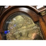 An 18th Century oak cased long case clock, the eight day movement with brass arch dial and pierced