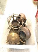 Two plastic crates containing sixteen various copper and brass teapots/spirit kettles together