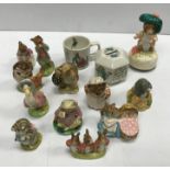A collection of eleven Beatrix Potter figurines comprising a Beswick brown back stamp Jeremy