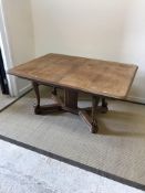 An early 20th Century Dutch walnut rectangular extending dining table, the plain top with moulded