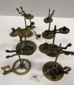 A collection of six 18th Century brass wax jacks various